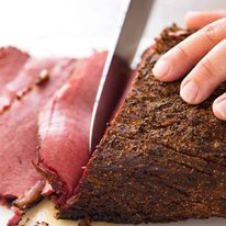 Easy homemade pastrami being sliced