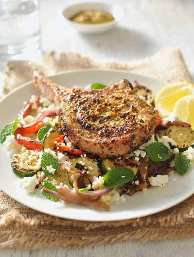 Lemon Pepper Pork with Grilled Veg and Feta Couscous closeup