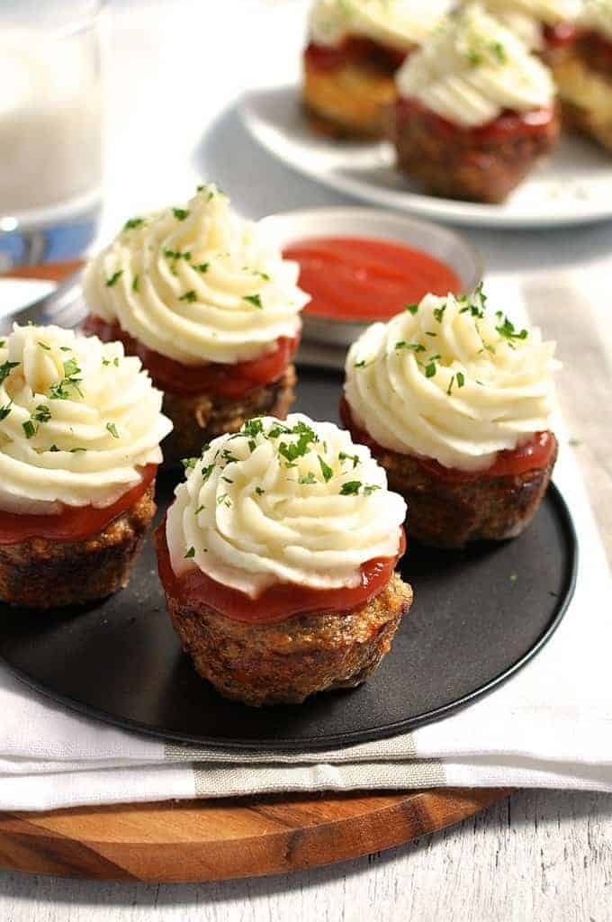 Meatloaf Cupcakes with Mashed Potato topping on a grey tray, ready to be served.