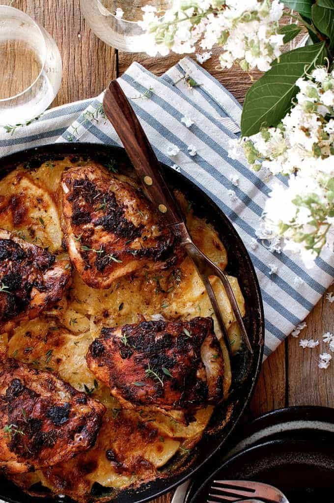 Overhead photo of a pan of Rotisserie Flavoured Chicken and Potato Bake with carving fork