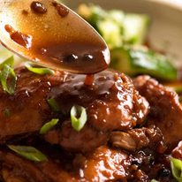 Close up of stick Filipino Chicken Adobo sauce