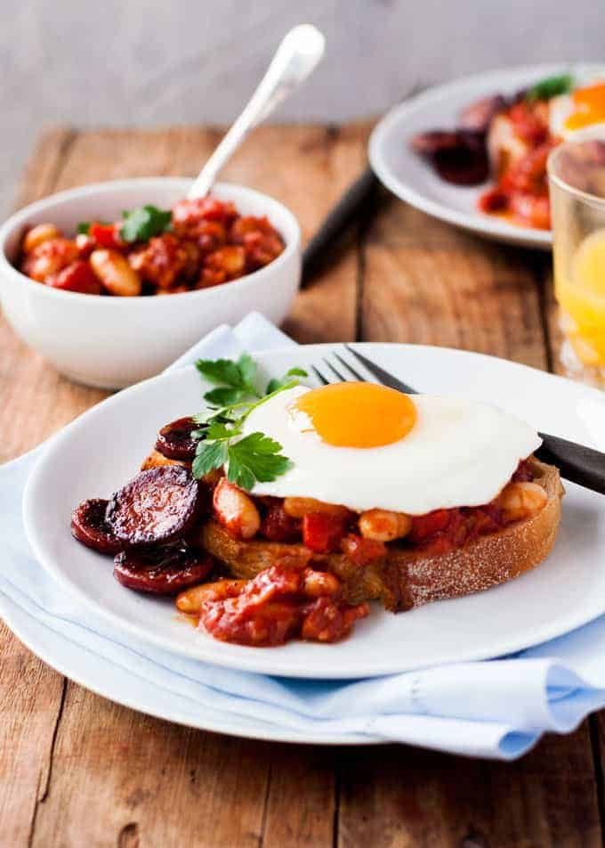 Chorizo Baked Beans on Toast topped with a fried egg