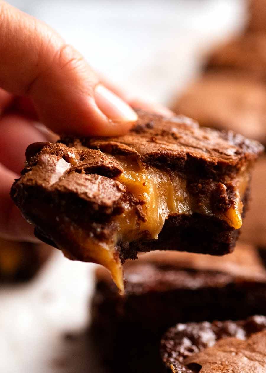 Hand holding Caramel Brownies