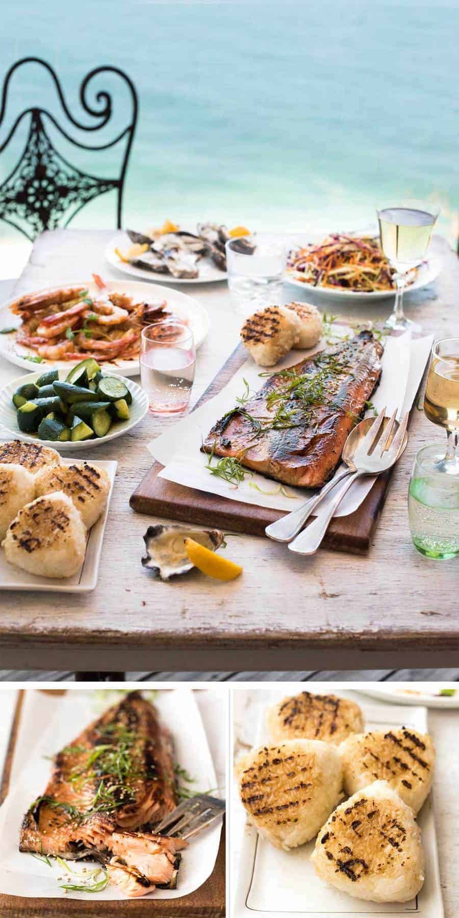 Overhead photo of an amazing Japanese BBQ menu with dishes including a BBQ Miso Salmon Side, grilled Asian prawns, grilled rice cakes, fresh oysters, Japanese cucumber salad and Asian Slaw.