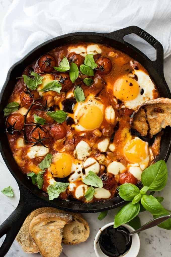 Caprese Baked Eggs with runny yolk eggs
