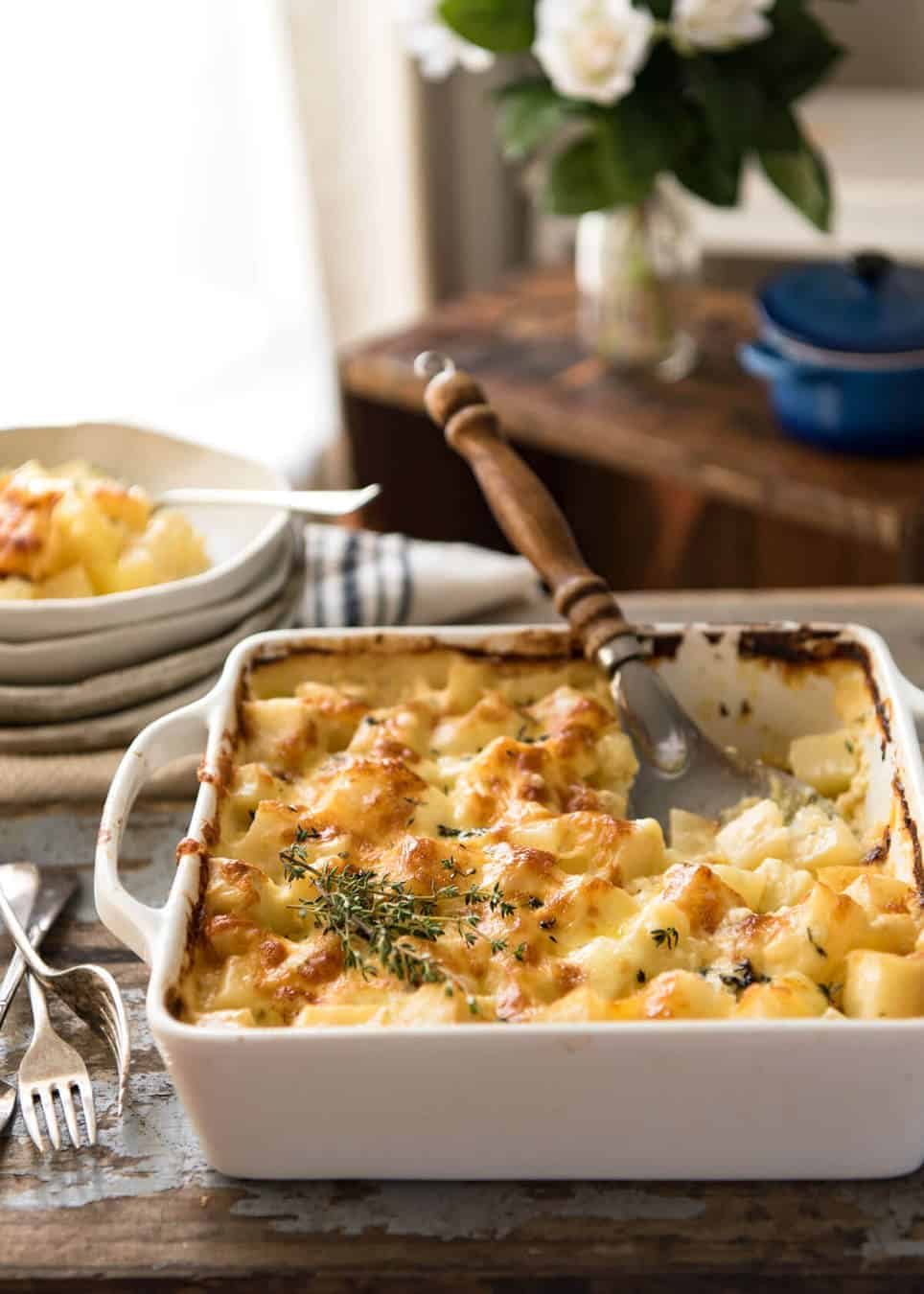 A faster, cheesier, creamier alternative to Scalloped Potatoes / Potato Gratin, this Easy Creamy Cheesy Potato Bake is made with cubed potatoes cooked in a cream and cheese sauce. www.recipetineats.com