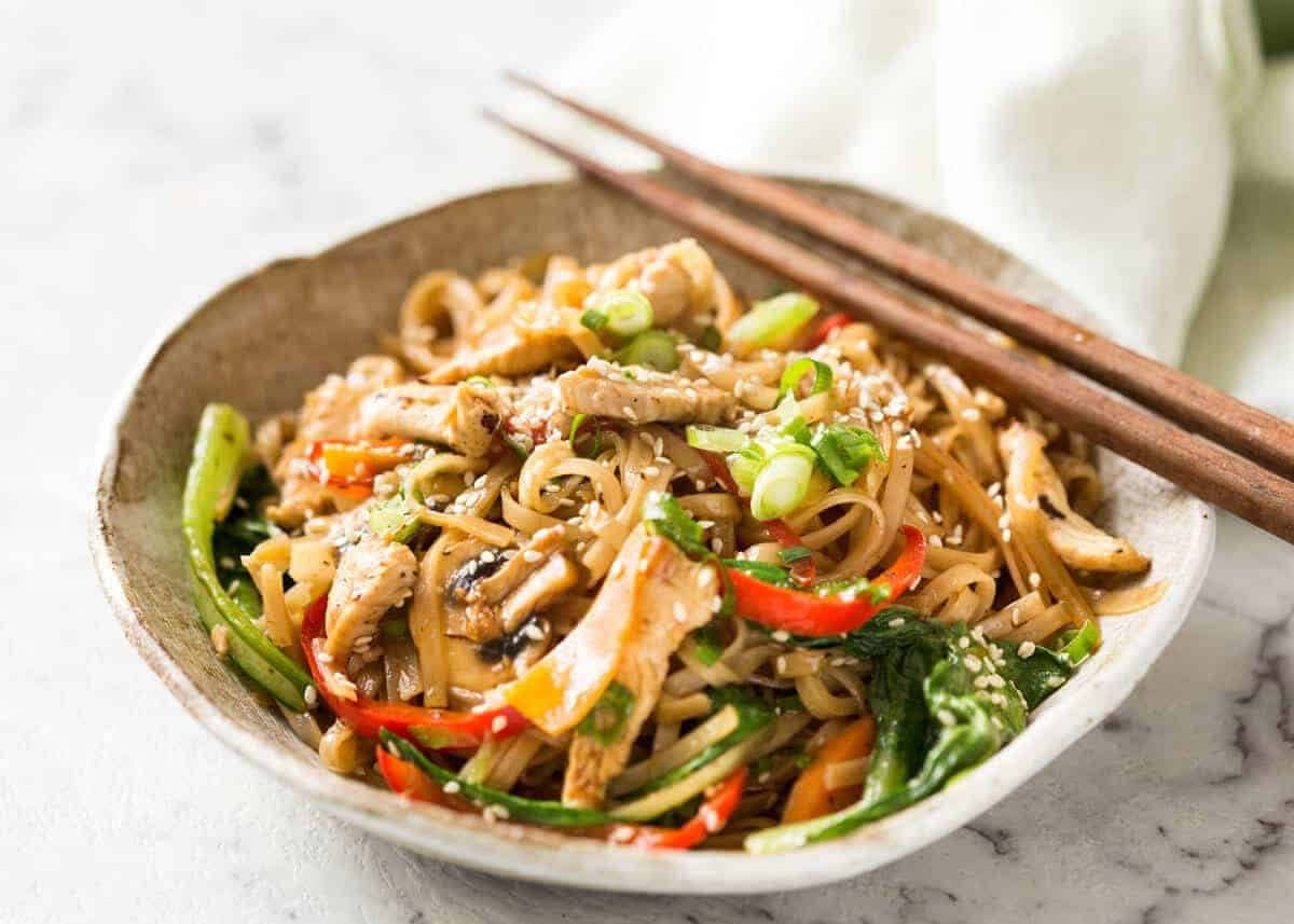 Great fridge forage meal - any dried noodles, any veggies, optional protein. This Chicken Stir Fry with Rice Noodles is healthy and super quick to make! recipetineats.com