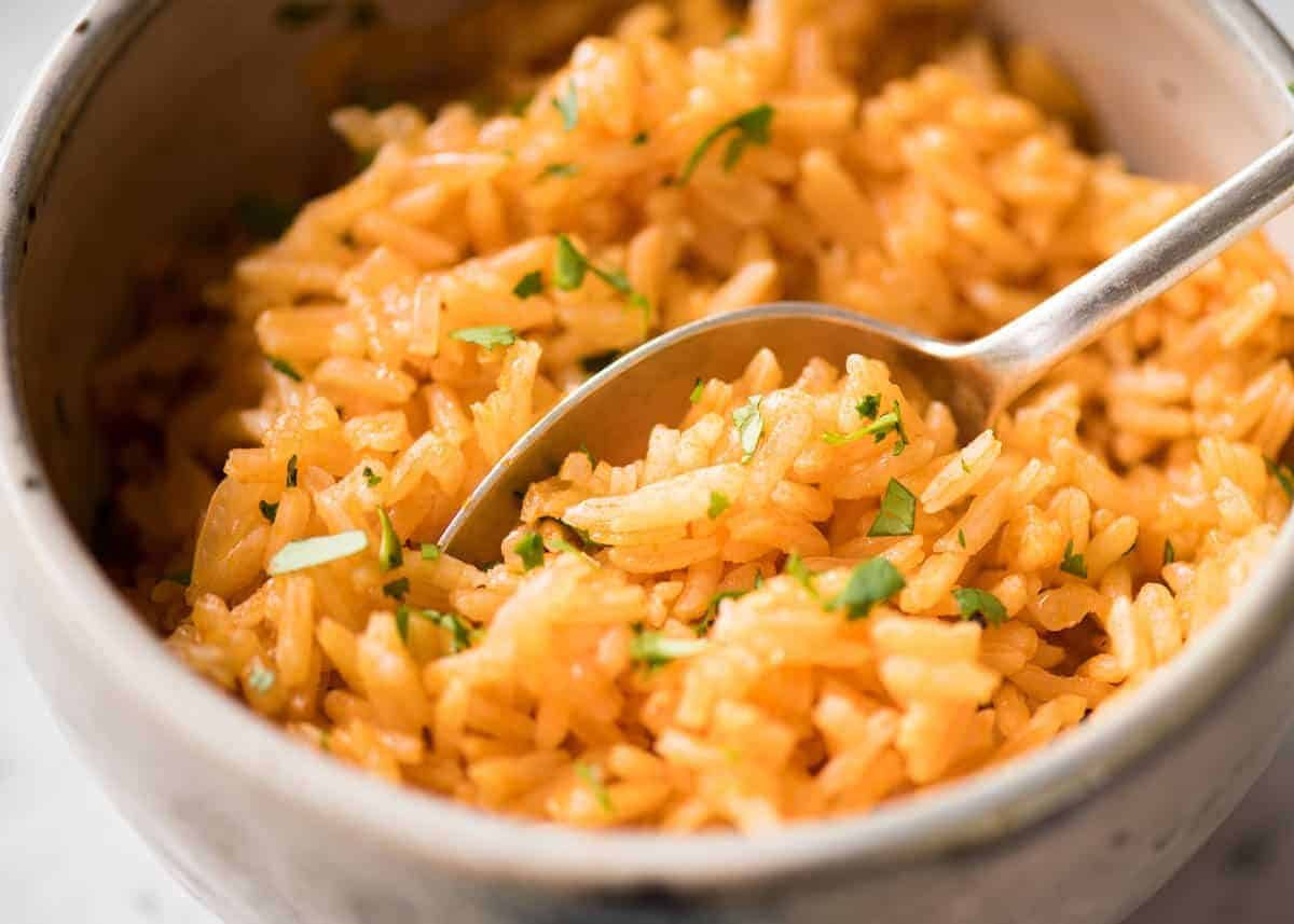 Fluffy, beautifully seasoned Mexican Red Rice (Arroz Rojo). Truly like what you get at restaurants! recipetineats.com