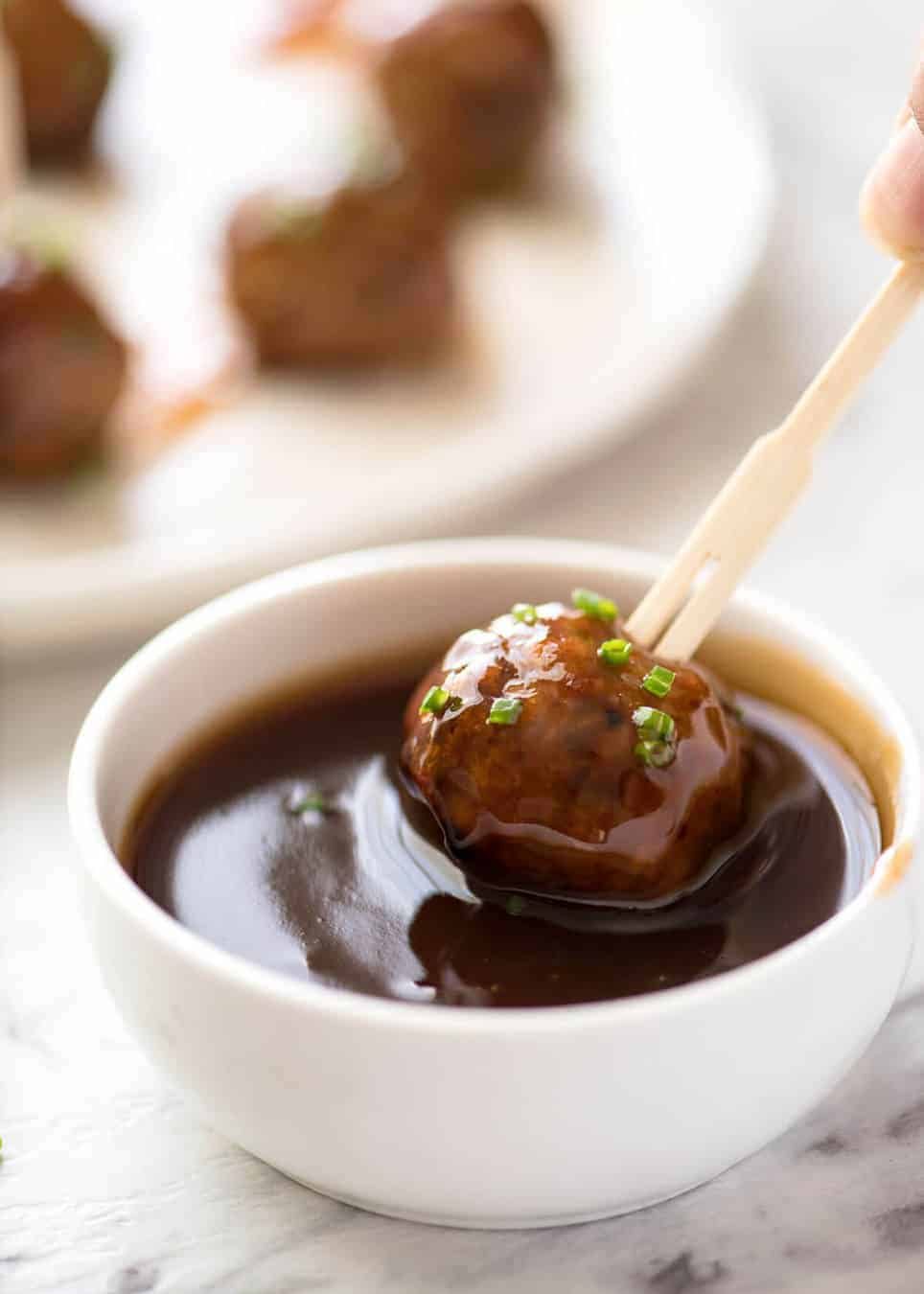 Plump, juicy and soft, these Party Cocktail Meatballs are baked and served with a fabulous Sweet & Sour Dipping Sauce that's super quick to make. Great make ahead for parties! www.recipetineats.com