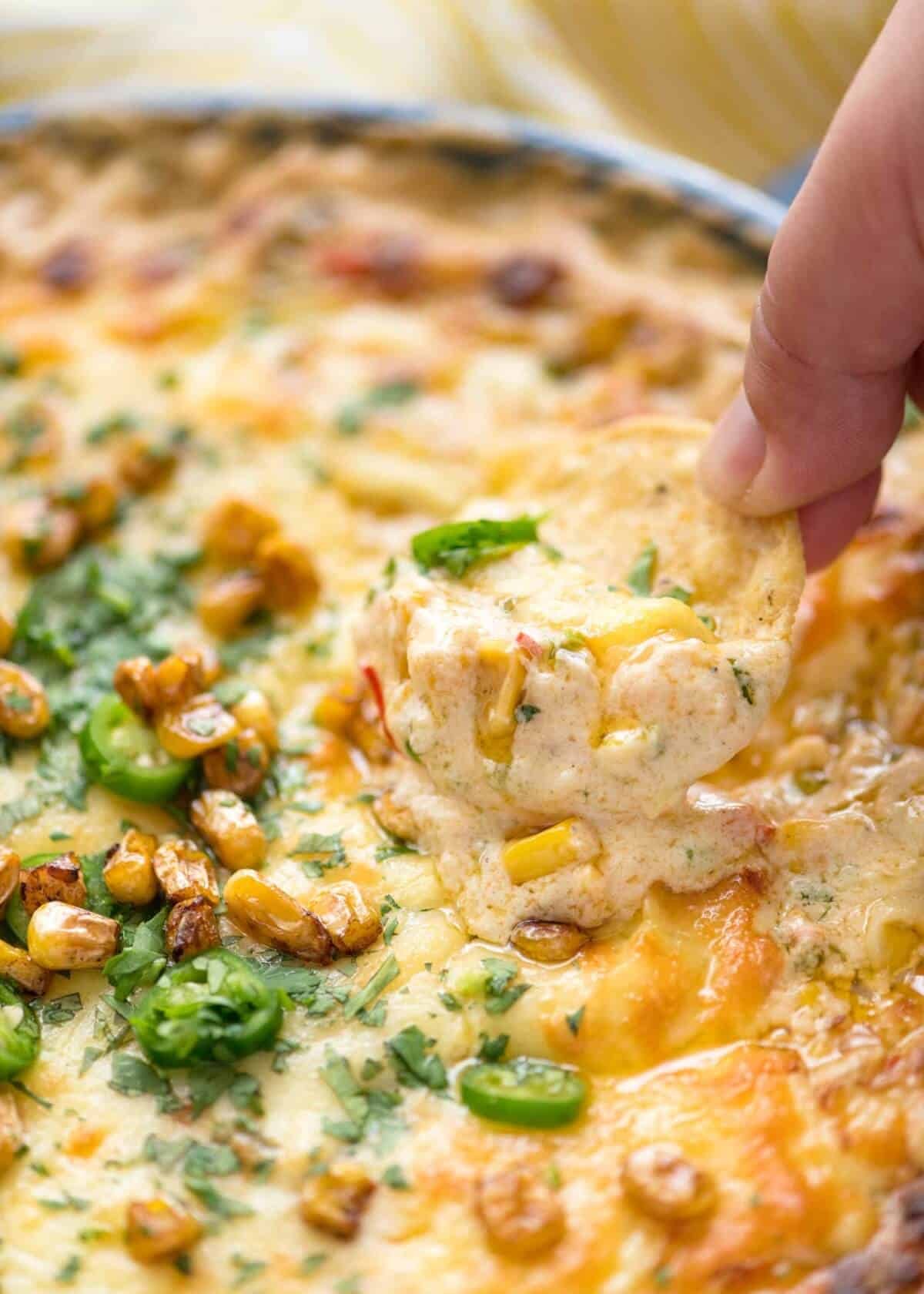 Essential Super Bowl food - a big batch Hot Corn Dip that's made for eating with eyes glued to the TV screen.