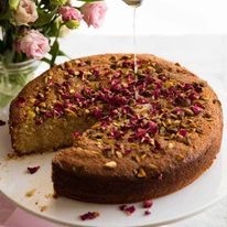A Persian love cake decorated with rose petals