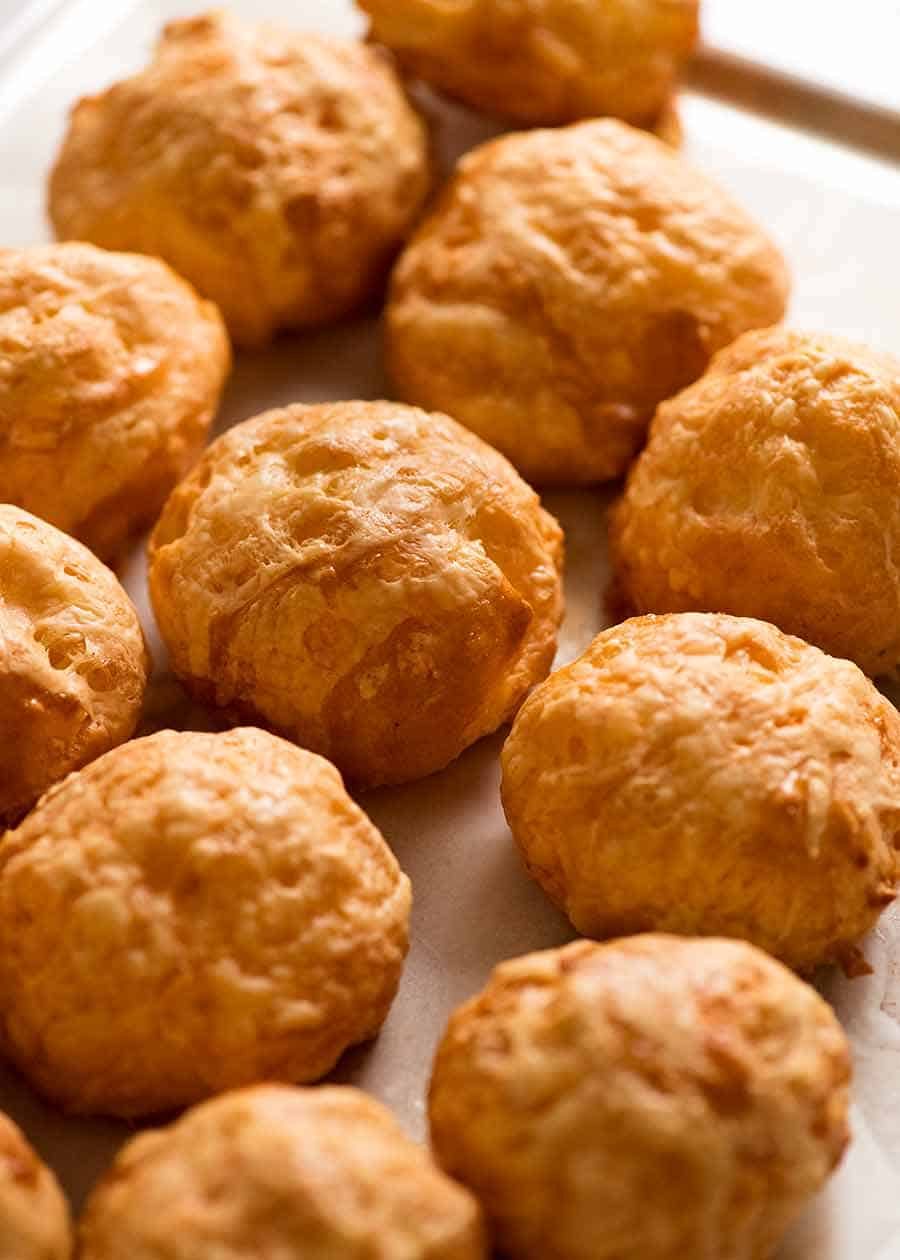 Tray filled with freshly baked Gougeres
