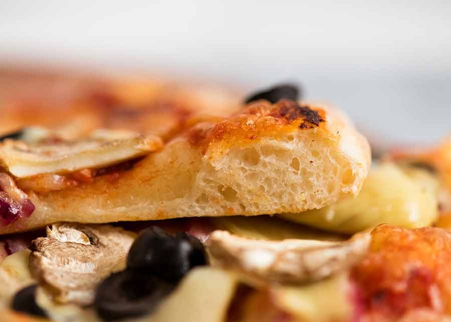 Close up showing crumb structure of homemade pizza dough / pizza crust